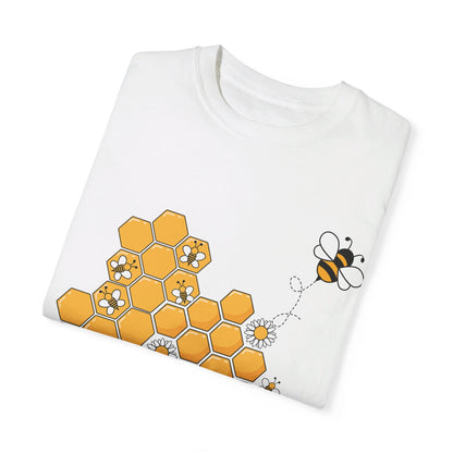 A trendy white t-shirt showcasing a vibrant bee and honeycomb design, perfect for adding a touch of nature to your wardrobe.